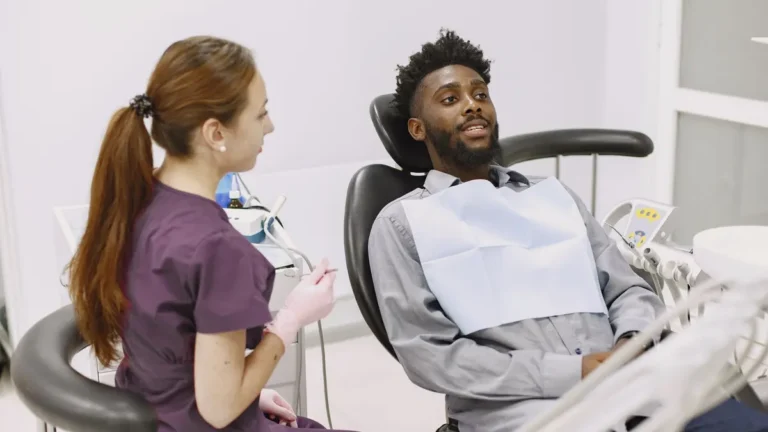 dentist consulting patient chair