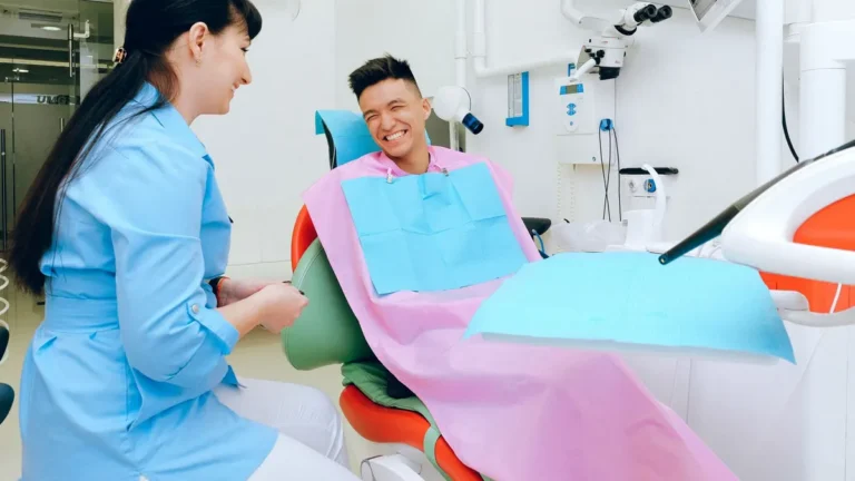 dentist consulting patient chair