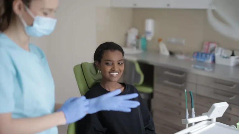 dentist consulting patient chair