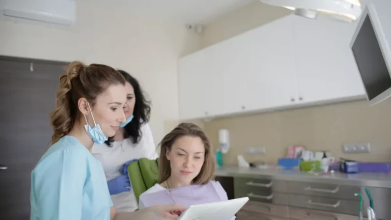 dentist consulting patient chair